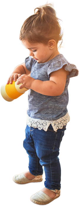 Young girl examining object with curiosity
